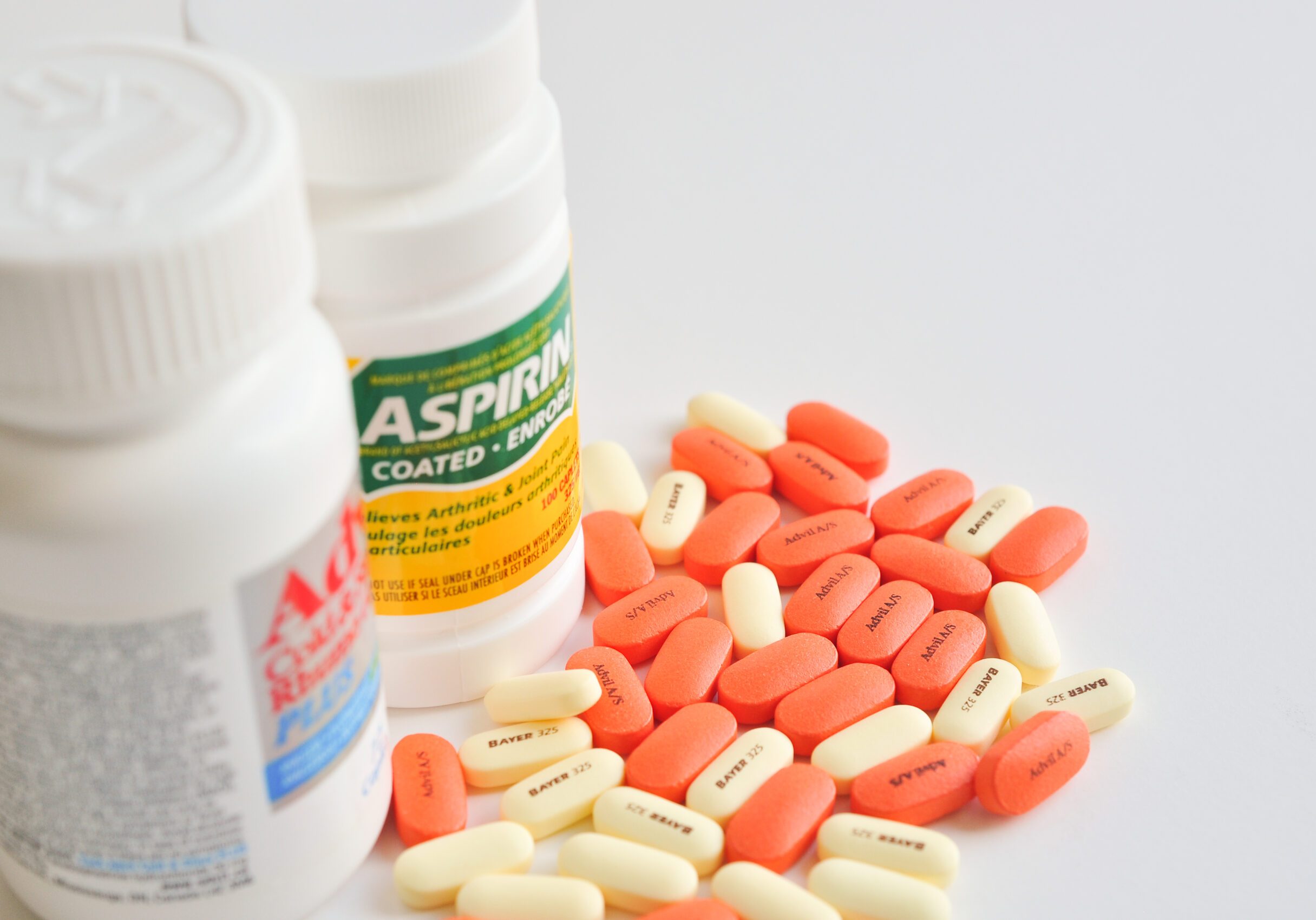 Pills of aspirin and advil
